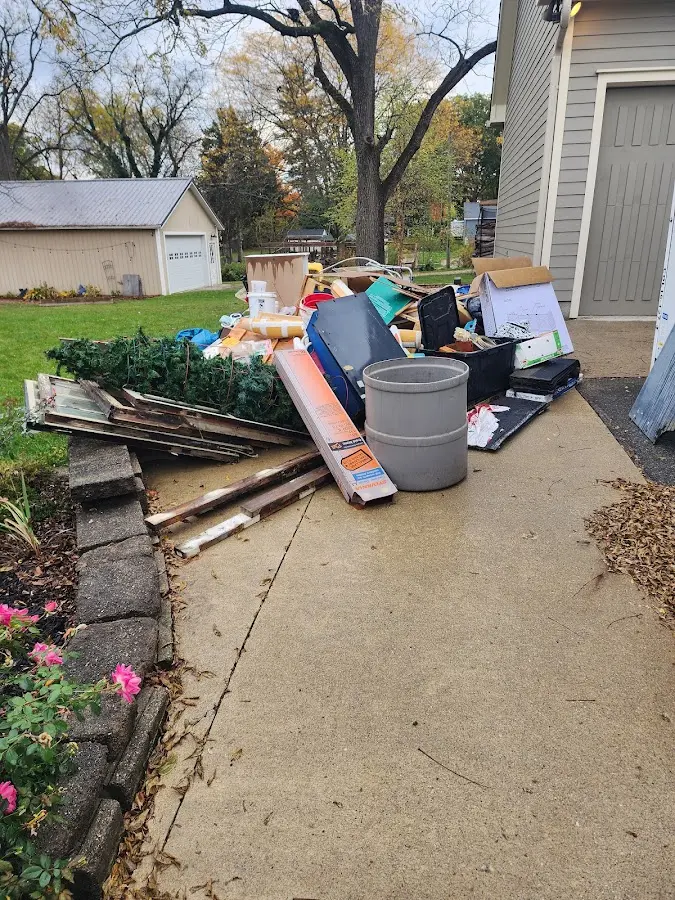 Dumpster being loaded with debris for Commercial Dumpster Rental in Millbrook